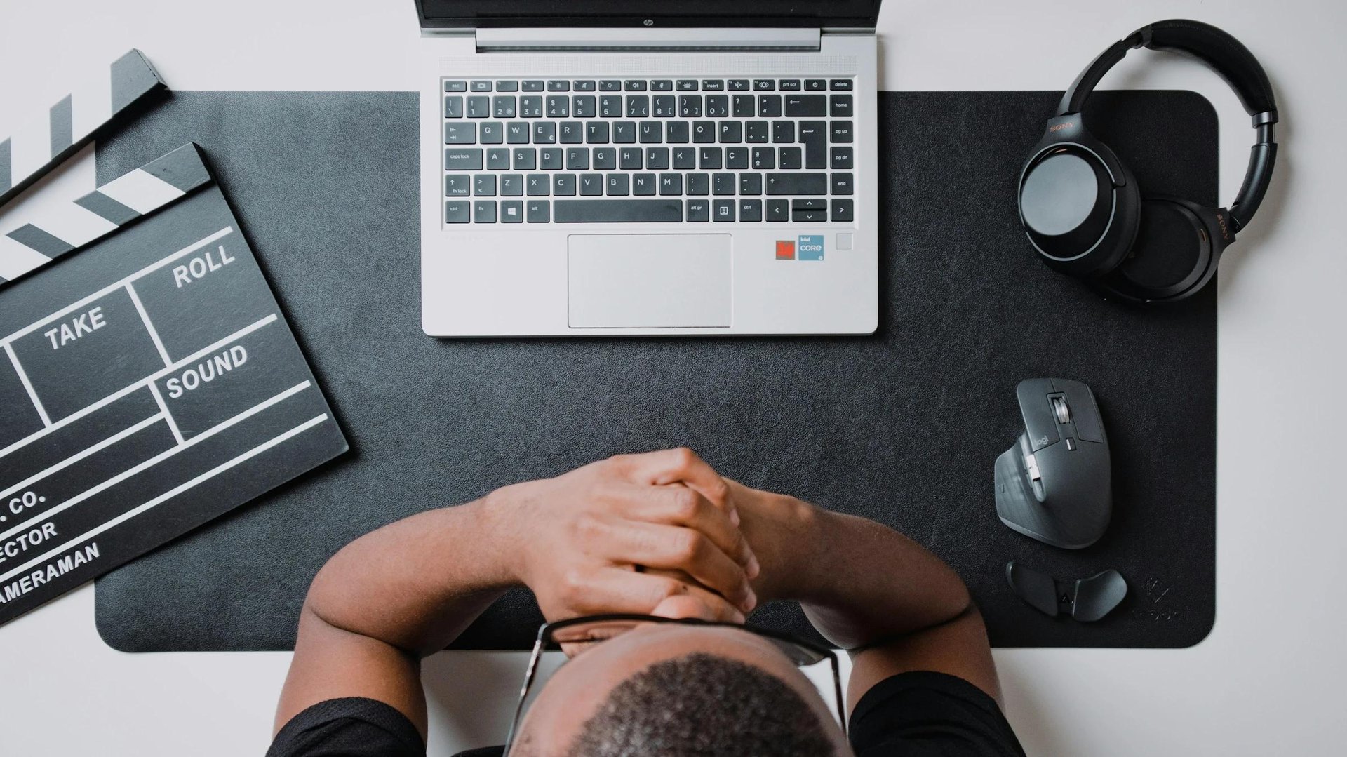 man looking at mobile - HeyGen Alternatives