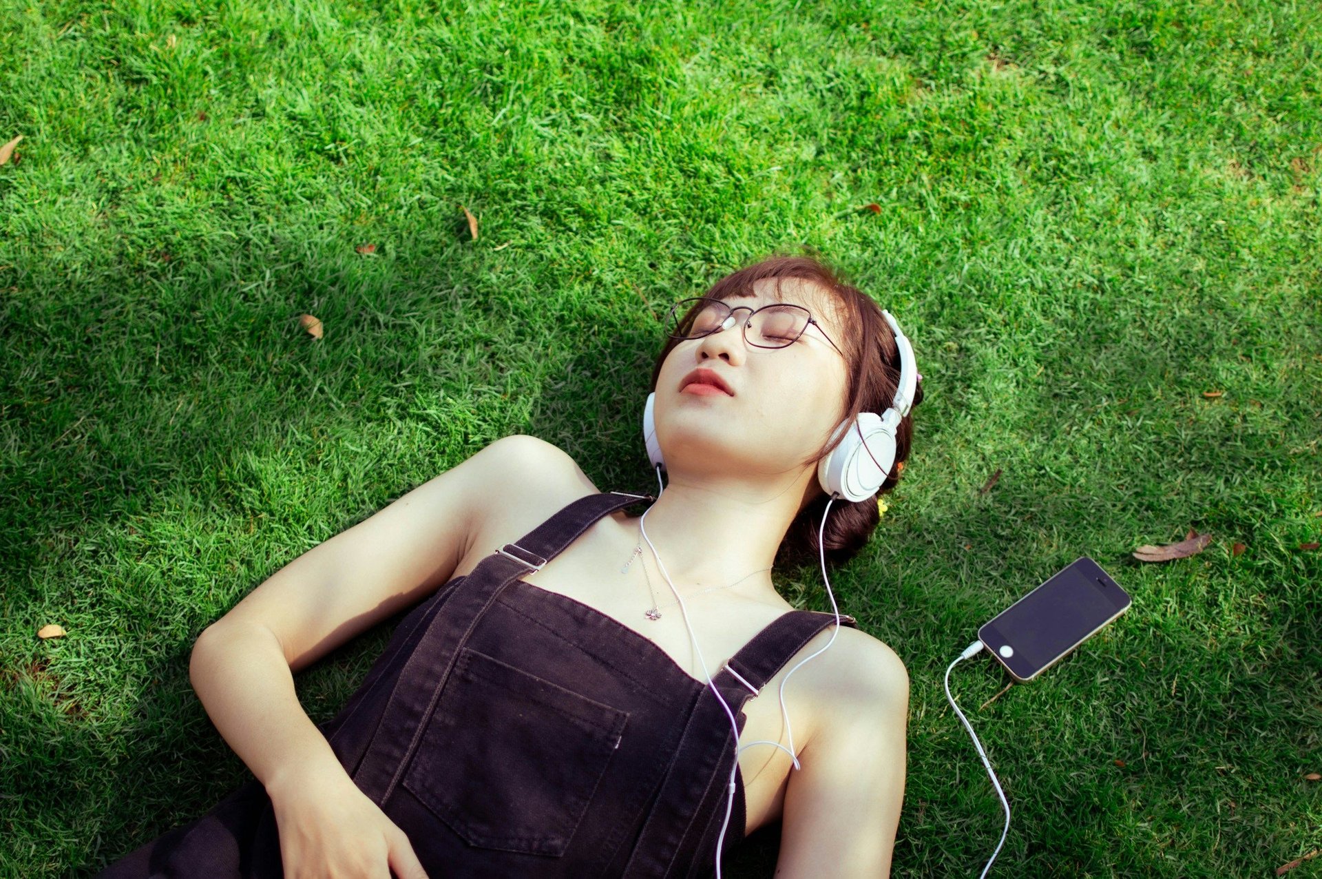 woman listening to songs - How Is AI Music Made